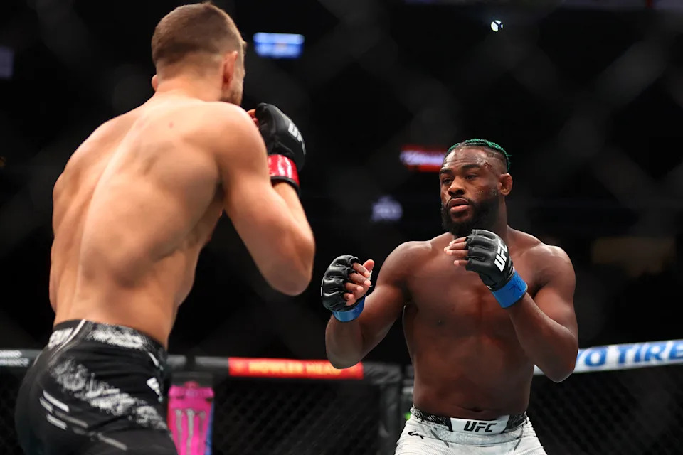 Apr 13, 2024; Las Vegas, Nevada, USA; Aljamain Sterling (blue gloves) fights Calvin Kattar (red gloves) during UFC 300 at T-Mobile Arena. Mandatory Credit: Mark J. Rebilas-USA TODAY Sports