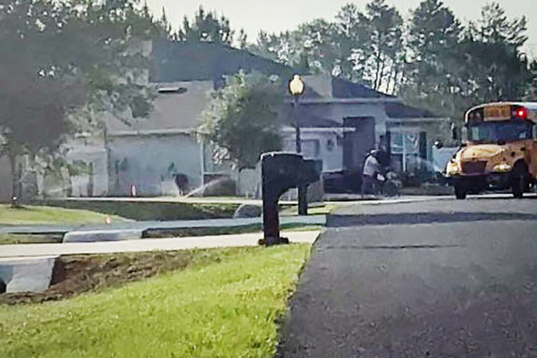 Man is accused of aiming sprinklers at students with disabilities waiting for a bus
